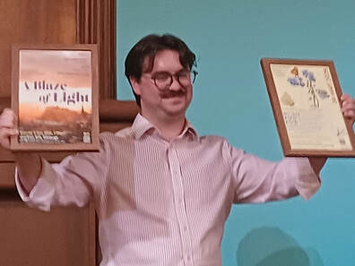 Fraser Macdonald with his posters.